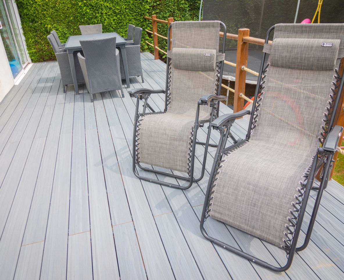 Sun loungers and table on Alchemy Habitat+ decking