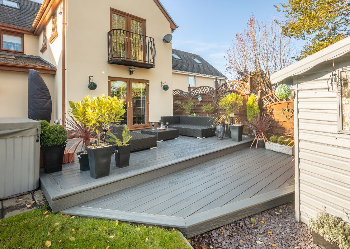 Alchemy Urban decking in a back garden covered in furniture and plants