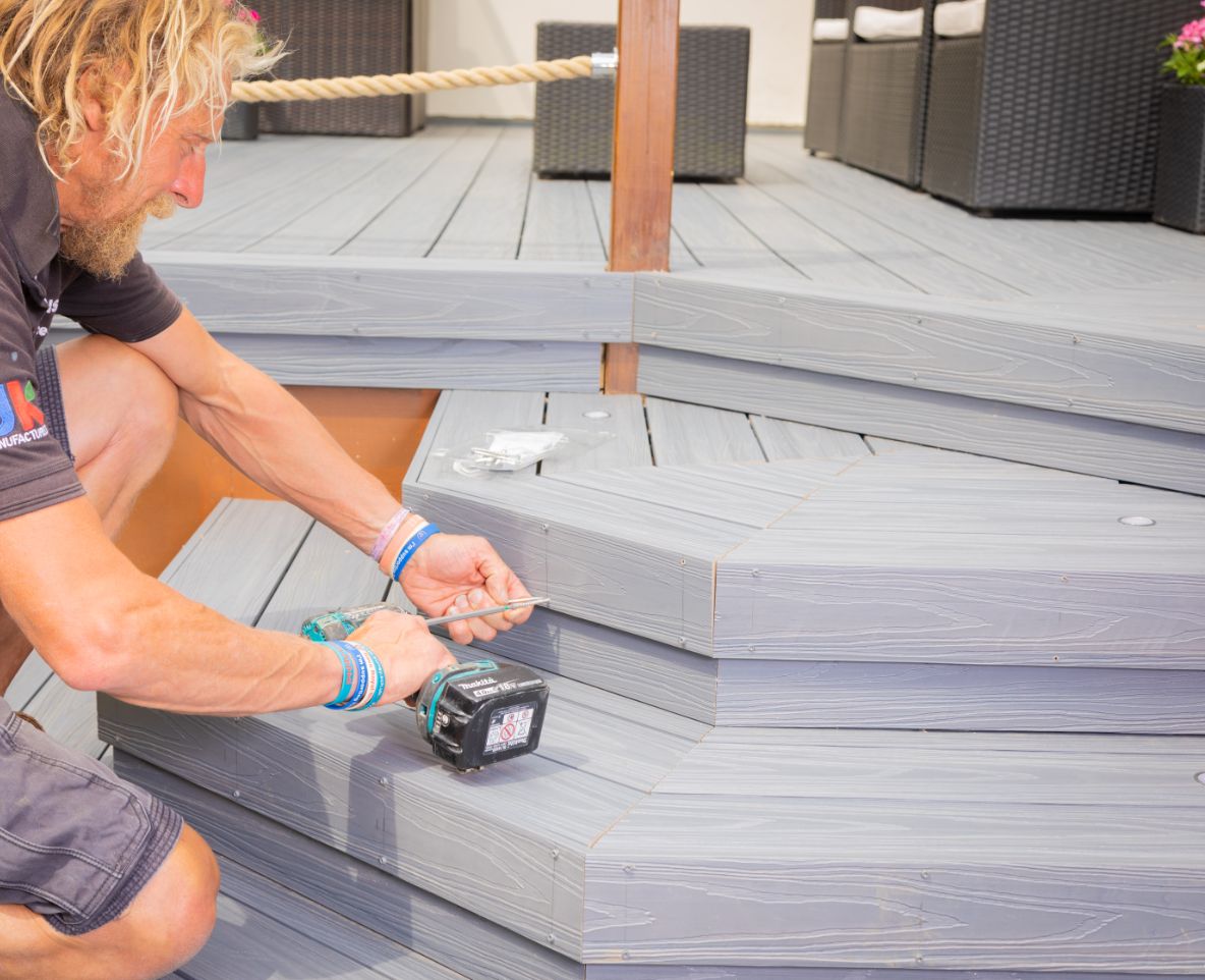 Builder installing Alchemy Composite Decking