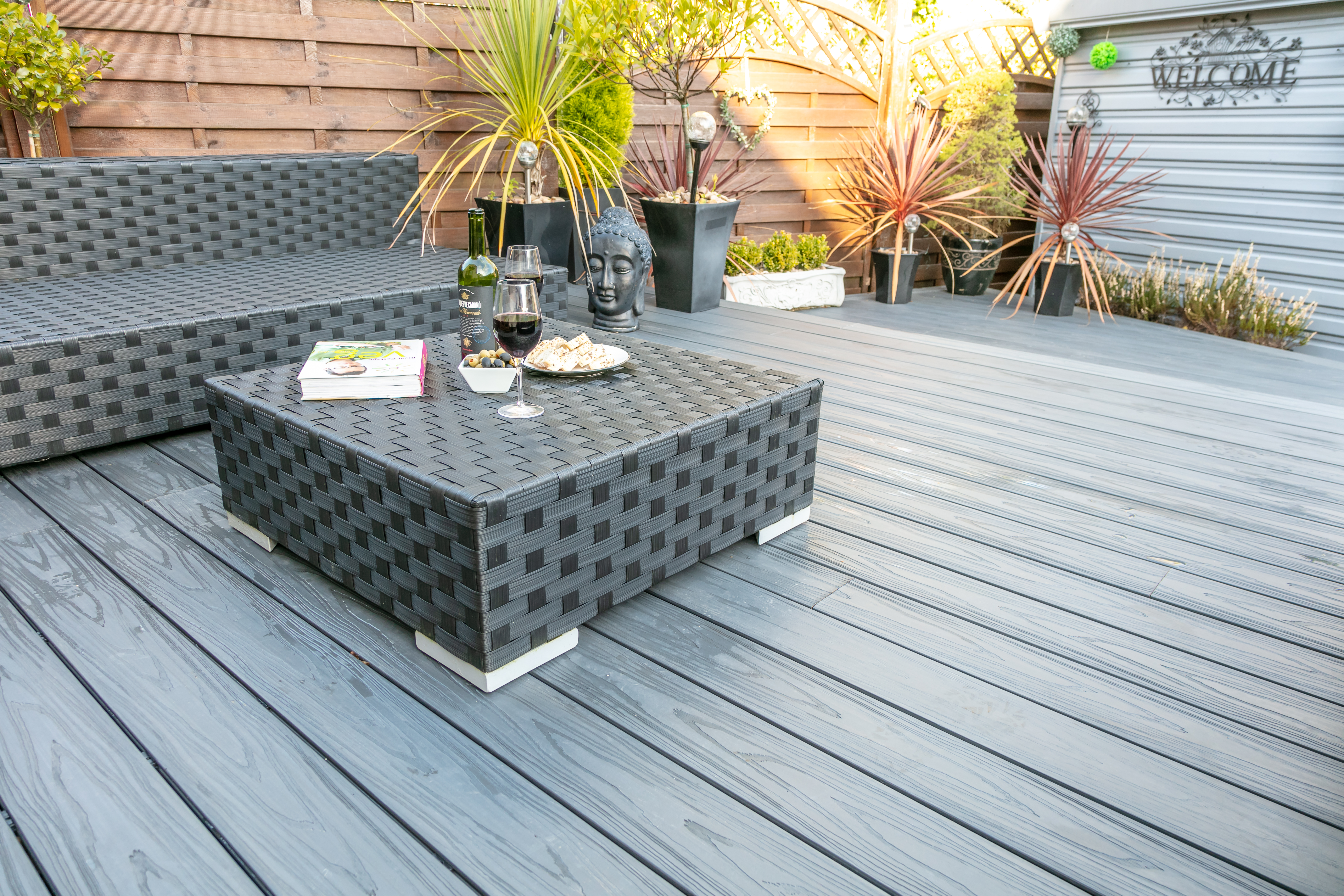 Garden furniture and potted plants on Alchemy composite decking